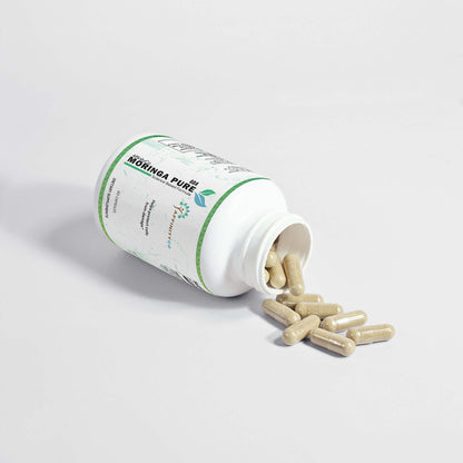 moringa oleifera capsules open bottle on its side