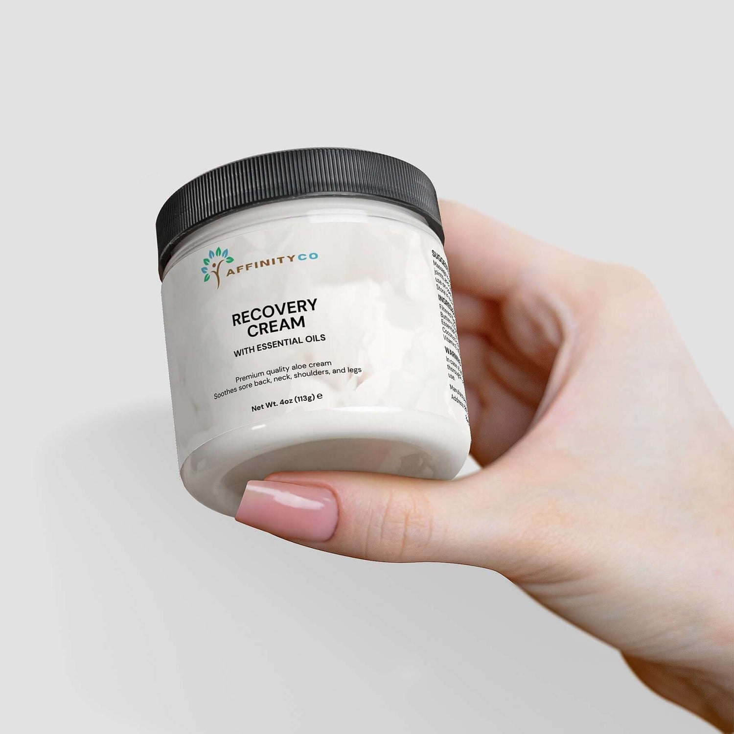 Recovery Cream held in one hand