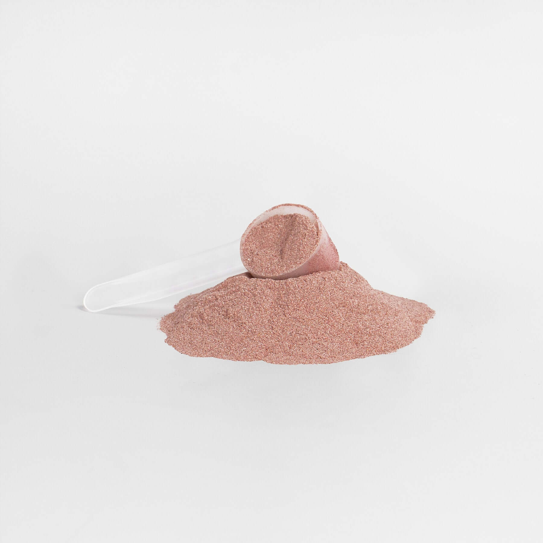 Reds Superfood Powder scoop with pile of powder